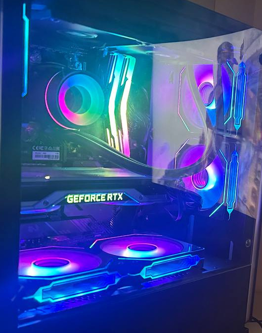 PC interior with multicolored fans, illuminated memory and a graphics card