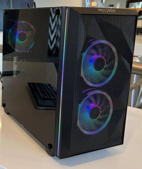 Black mesh-front tower with two illuminated front fans