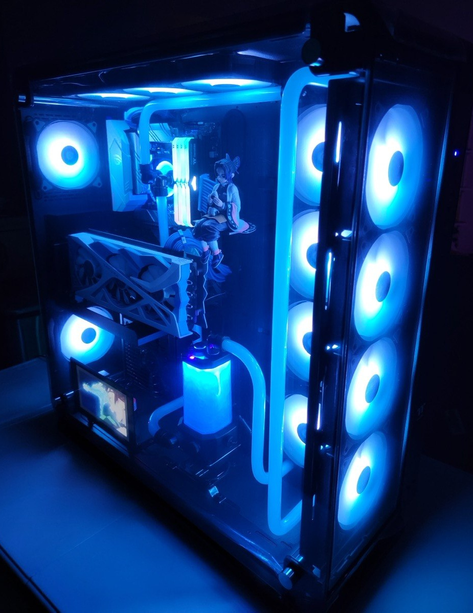 Angled black case with blue fan rings, rigid CPU-loop tubing and a white fan-cooled graphics card