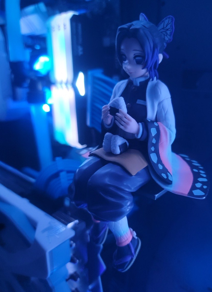 Small character figure inside a blue-lit PC case