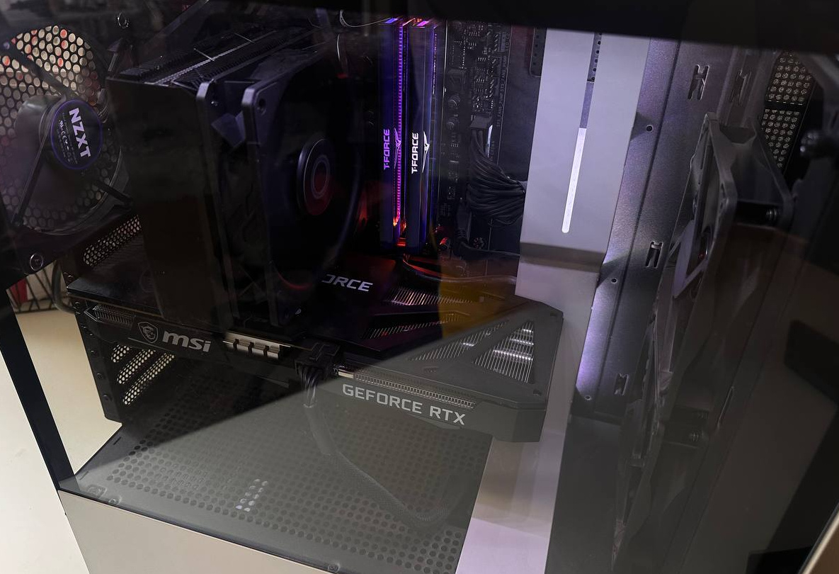 PC interior with silver tower cooler and dark graphics-card shroud