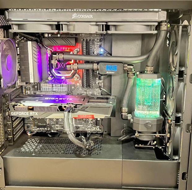 Black case with cooling tubes, reservoir and illuminated internal components